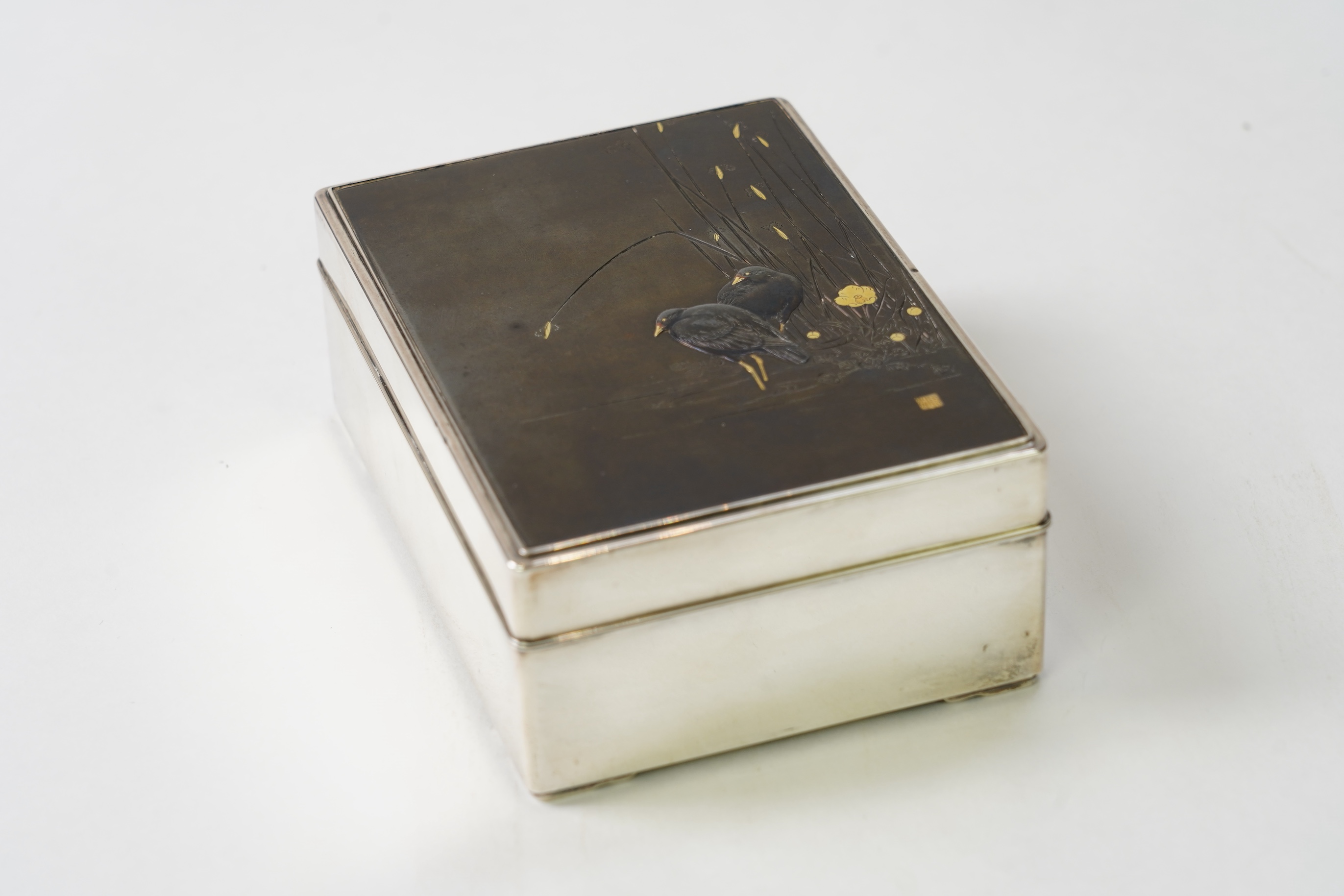 A Japanese shibuichi and shakudo mounted silver box and cover, Taisho period
